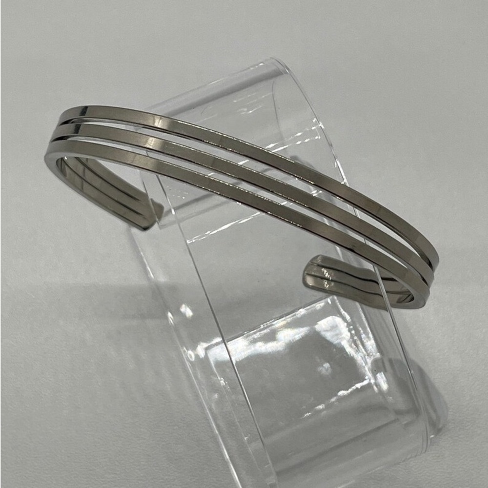 A Smart Unbranded Triple Banded 10K GP White Gold Cuff Bracelet